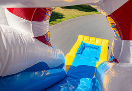 Inflatable luchtkussen met spring gedeelte en glijbaan in rubber eend thema te koop voor kinderen