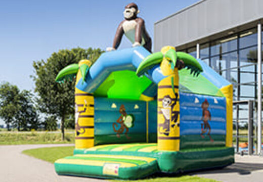 Standaard jungle springkasteel voor kinderen kopen in opvallende kleuren met bovenop een groot 3D object in de vorm van een gorilla. Bestel springkastelen online bij JB Inflatables Nederland