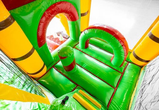 Springkasteel in jungleworld thema met een glijbaan bestellen voor kinderen. Koop opblaasbare springkastelen online bij JB Inflatables Nederland
