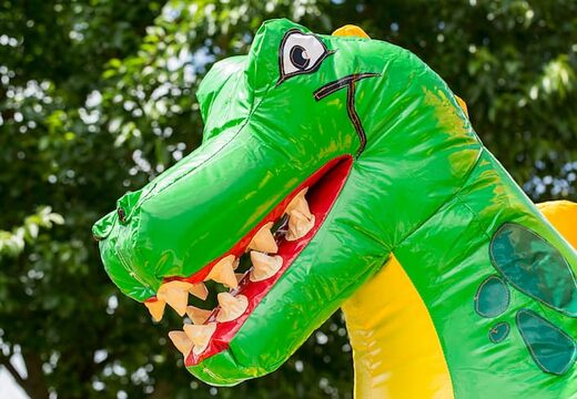Opblaasbaar slide combo springkasteel met glijbaan bestellen in thema dino voor kinderen. Koop springkastelen met groene dinosaurus bij JB Inflatables Nederland