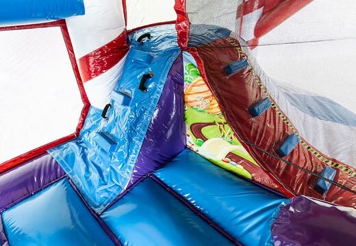 Multiplay candyland springkussen met een glijbaan en met binnenin 3D objecten  bestellen voor kids. Koop opblaasbare springkussens online bij JB Inflatables Nederland